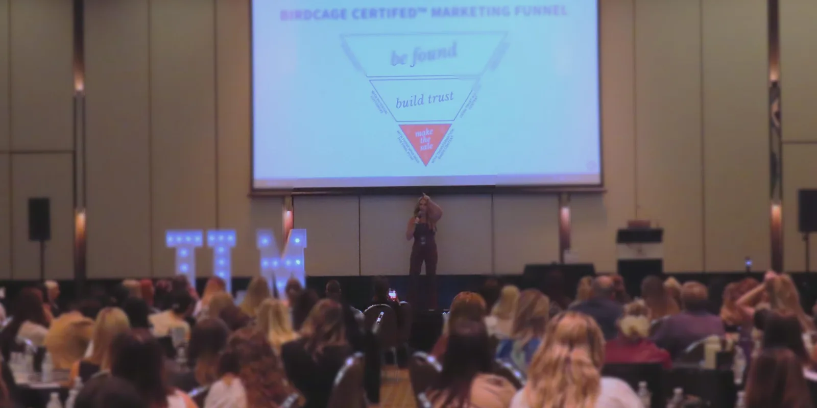 Maddy Avery speaking to a room